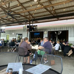 people sitting at tables in a restaurant