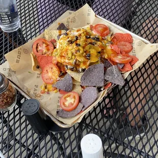 a plate of nachos and chips