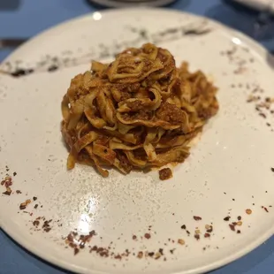 a plate of pasta on a table