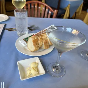 Martini, glass of wine and bread.
