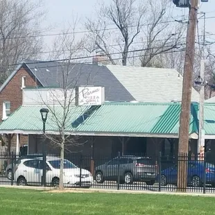 cars parked in front of a restaurant