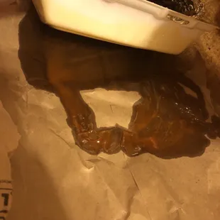 a person dipping a doughnut