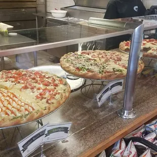 pizzas on display