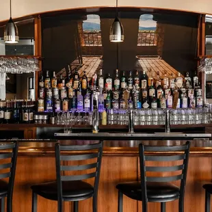 a bar with wine bottles on it