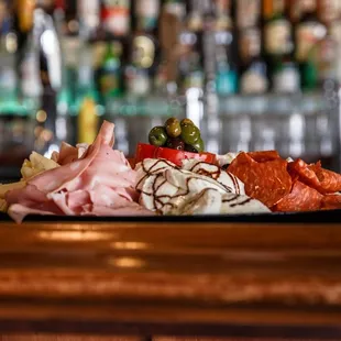 a platter of meats and cheeses