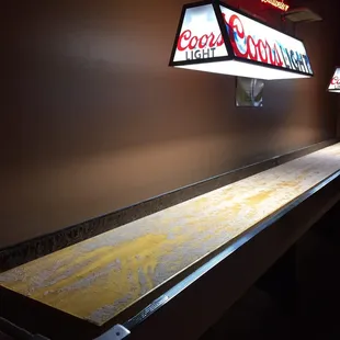 a shuffle table in a bar
