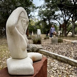 There are stone sculptures within the same area