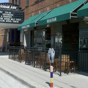 a parking meter on the sidewalk