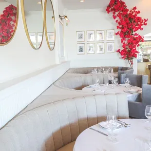 a dining area with tables and chairs