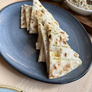 a plate of flatbreads on a table