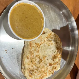 a bowl of soup and a plate of food