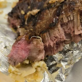 Raw Ribeye that was ordered very well done.