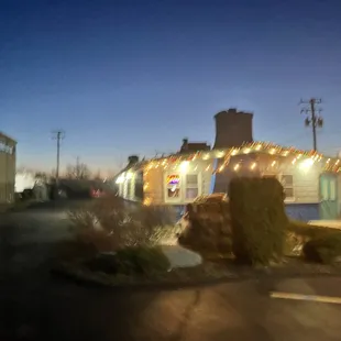 the exterior of a motel at night