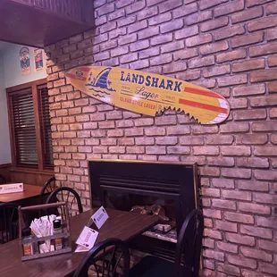 a surfboard on the wall of a restaurant