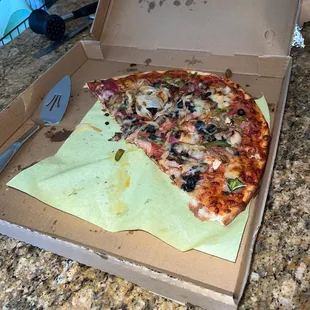 This is the morning after. New York combo. Half of it leftover. Usually we just sniff out our pizza.