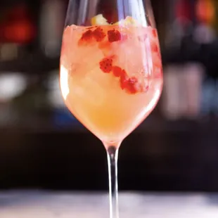 a closeup of a drink in a wine glass