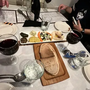 a table full of food and wine