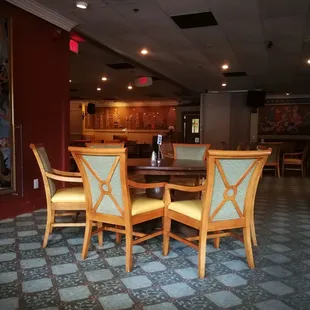 a table and chairs in a restaurant