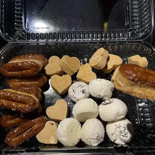 a variety of pastries in a plastic container