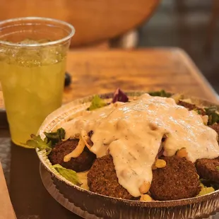 falafel bowl with cucumber drink.