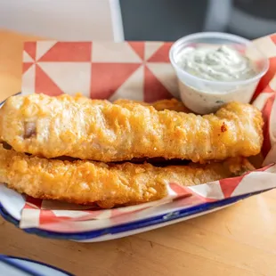 two plates of fish and chips