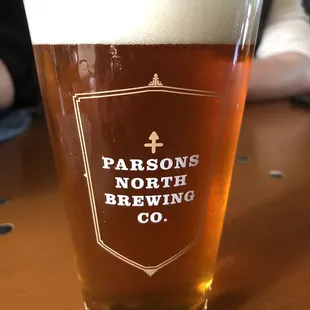 a glass of beer on a table