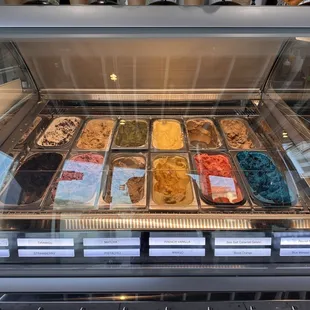 a display case filled with different types of ice cream