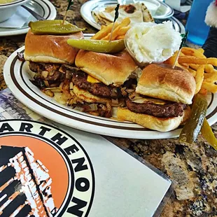 a plate of sandwiches and french fries