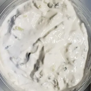 The house made tzatziki sauce, that's a big container for home use and not the small gyro container.
