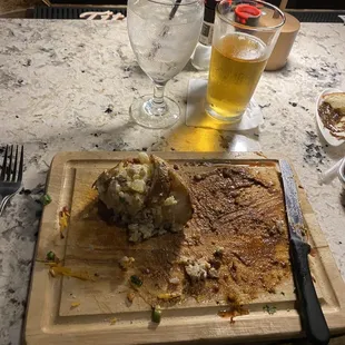 a plate of food and a glass of beer
