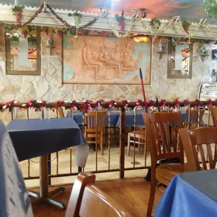 tables and chairs with blue tablecloths