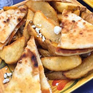 Potatoes with feta cheese and pita bread