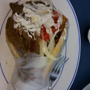 a plate with a sandwich and salad