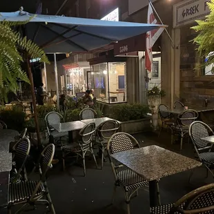 tables and chairs outside at night