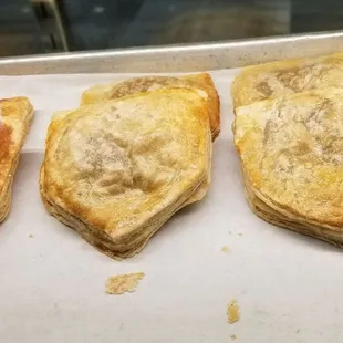 three pastries on a baking sheet