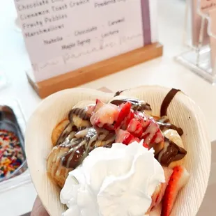 a person holding a plate of food