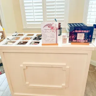 a counter with a variety of pastries on it