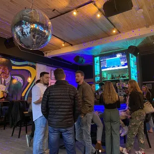 a group of people in a bar