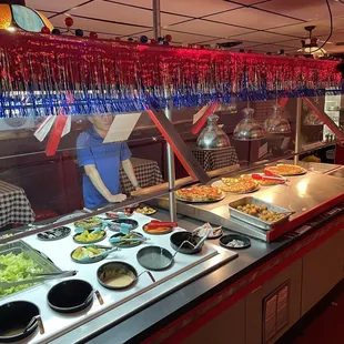 a buffet with a variety of food items