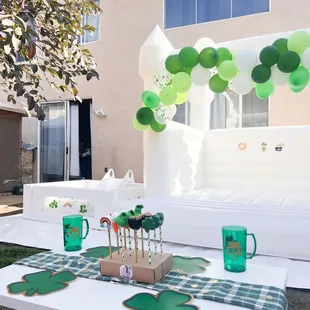 Children's table, 10x10 white bounce house, and 5x5 clear white ball pit. With slide