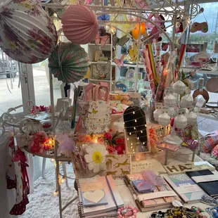 Lanterns, journal sets, gift bags, &amp; cupcake display w/ earrings.