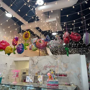 Balloons w cute ambiance. Treat sets, cotton candy, all things party.