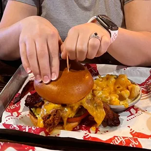 Nashville hot chicken N&apos; cheddar sandwich w/ skillet Mac n&apos; cheese and a side of ranch for dipping sauce.