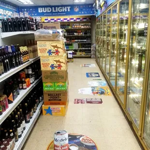 a beer aisle in a grocery store