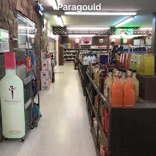 the aisle of a liquor store
