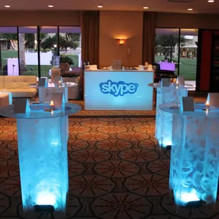 Customized LED logo bar and tables for corporate event.