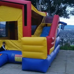 Want a combo slide for a smaller backyard rent our 15x15 5 In 1 Combo for your next event.