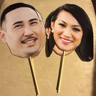 Custom face props of the bride and groom.