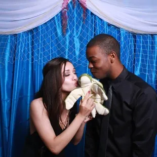 The photobooth backdrop and a prop they left for us to use (the couple kept trying to keep the turtle)