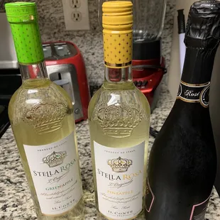 three bottles of wine and a blender